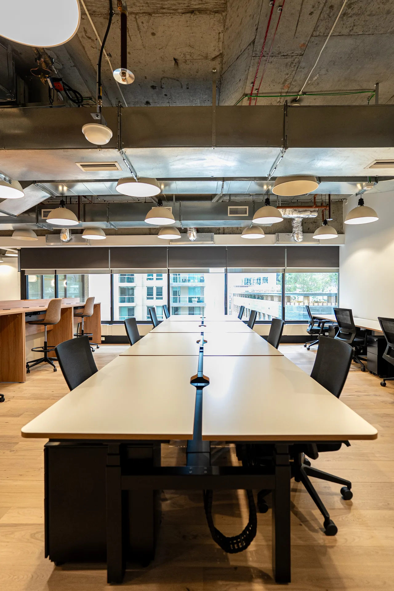 Long workstation bench with cable tray installed in a Sydney CBD office
